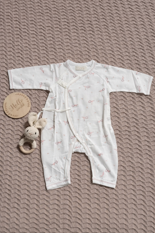 White Wrap-Style Onesie with Pink Trim (Patterned)
